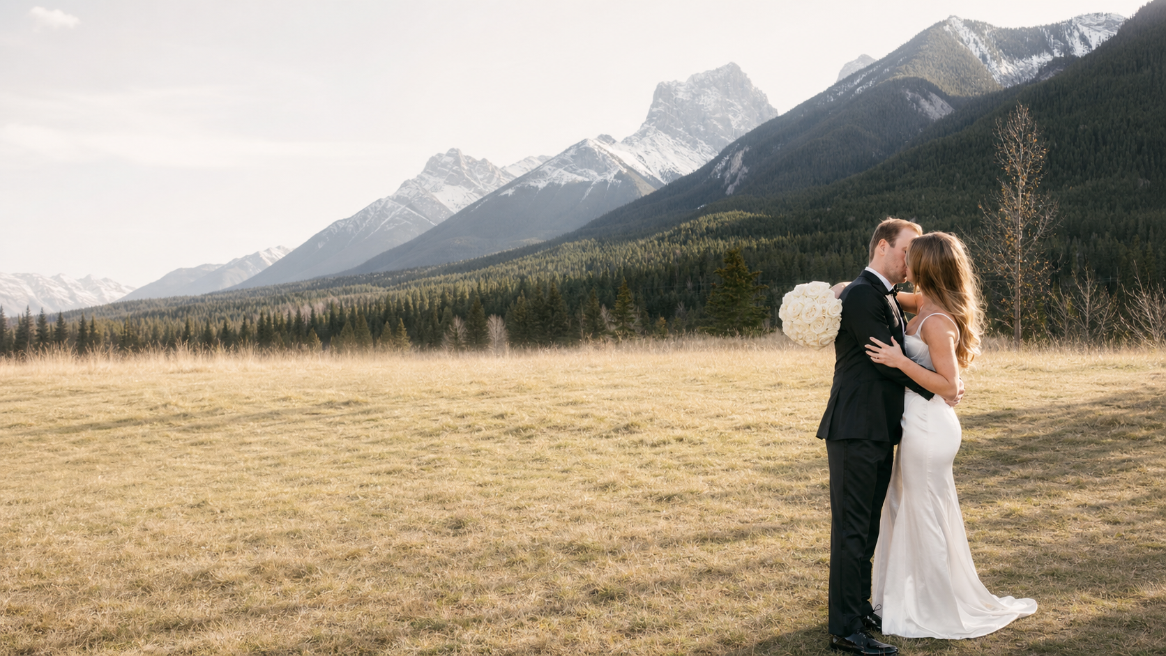 Bride and groom with wedding party in the mountains
